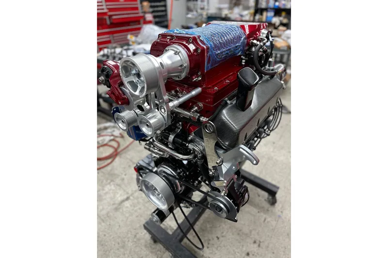 Slide: The Image of High-performance engine of a 2013 Nordic 39 POKER RUN boat in a workshop setting. - 36