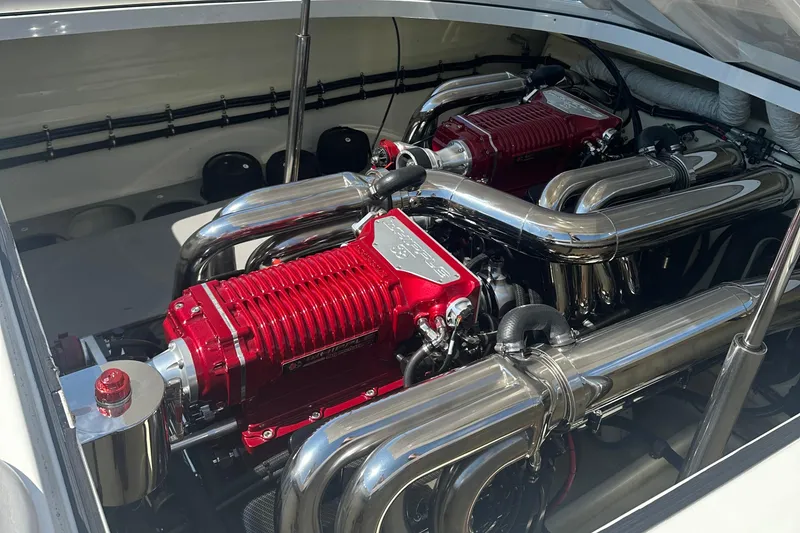 Slide: The Image of Engine compartment of a 2013 Nordic 39 POKER RUN boat with dual red engines. - 15