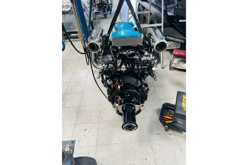 Slide: The Image of Engine of a 2013 Nordic 39 POKER RUN boat in a workshop setting. - 33