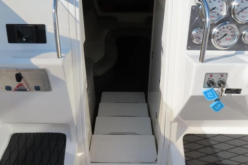 Slide: The Image of Interior view of a 2013 Nordic 39 POKER RUN boat, featuring gauges and cabin entrance. - 28