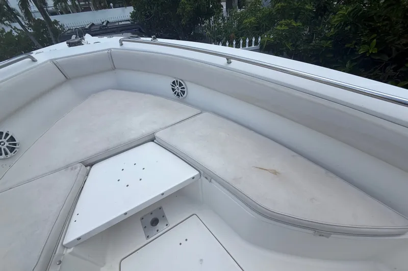 Slide: The Image of 2007 Robalo R260 Center Console boat interior with cushioned seating and speakers. - 36