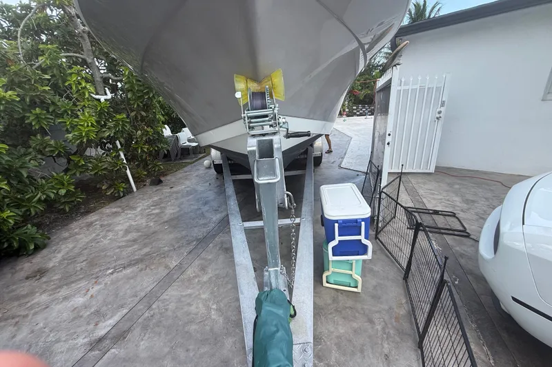 Slide: The Image of 2007 Robalo R260 Center Console boat on trailer in driveway setting. - 3