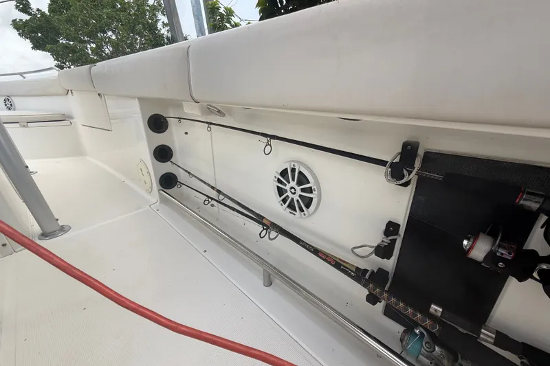 Slide: The Image of 2007 Robalo R260 Center Console fishing rod storage area with speaker and rod holders. - 61