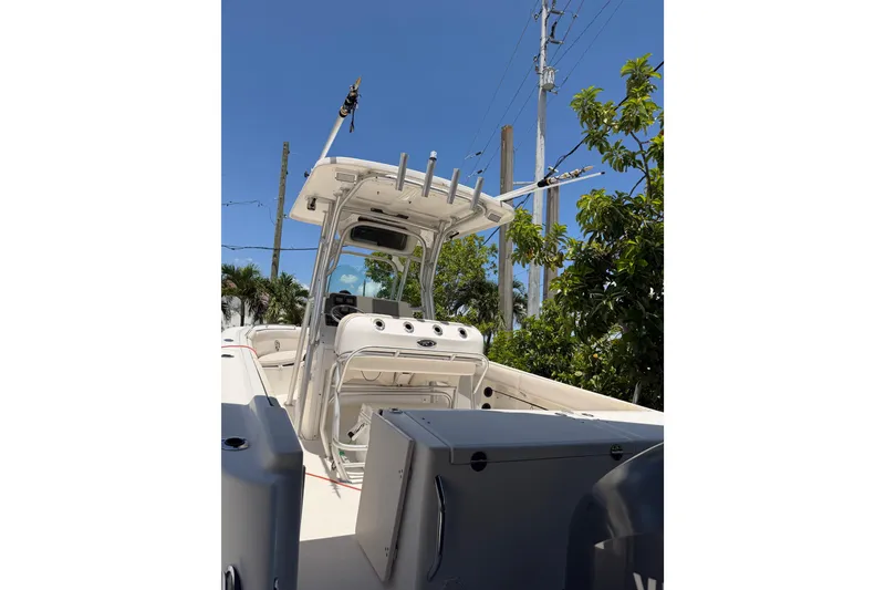 Slide: The Image of 2007 Robalo R260 Center Console boat with T-top and fishing rod holders. - 14