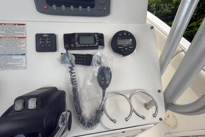 Slide: The Image of 2007 Robalo R260 Center Console dashboard with marine electronics and controls. - 52