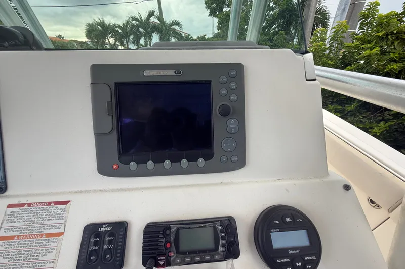 Slide: The Image of 2007 Robalo R260 Center Console dashboard with navigation and control systems. - 49
