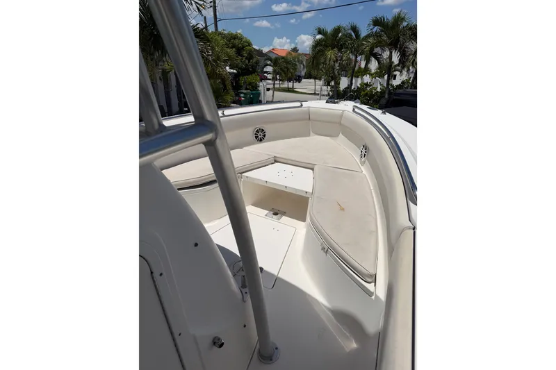 Slide: The Image of 2007 Robalo R260 Center Console boat interior with cushioned seating and storage. - 9