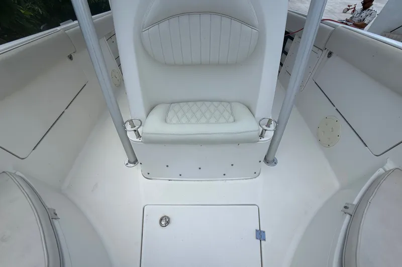 Slide: The Image of 2007 Robalo R260 Center Console boat interior with white seating and cup holders. - 39