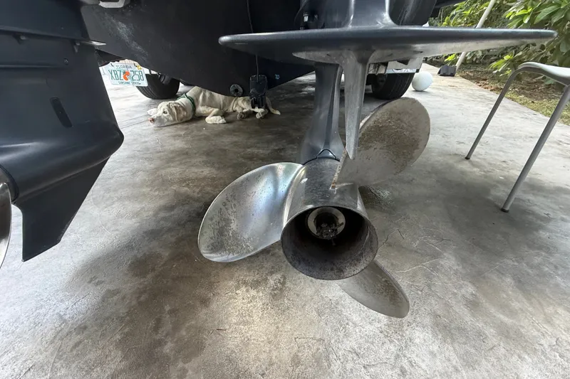 Slide: The Image of Propeller of a 2007 Robalo R260 Center Console boat on concrete surface. - 16