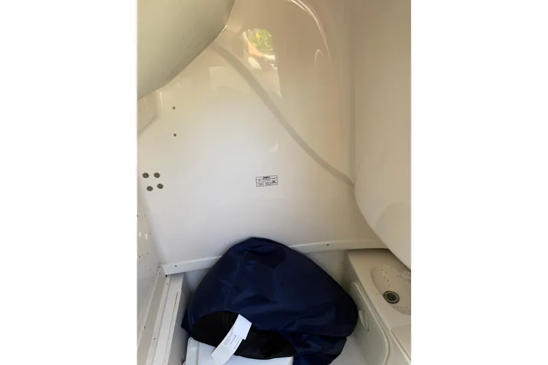 Slide: The Image of Interior of 2007 Robalo R260 Center Console boat with storage compartment. - 6