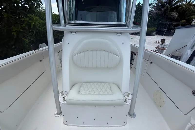 Slide: The Image of 2007 Robalo R260 Center Console boat with white seating and stainless steel frame. - 40