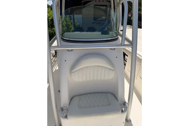 Slide: The Image of 2007 Robalo R260 Center Console boat interior with cushioned seating and windshield. - 8