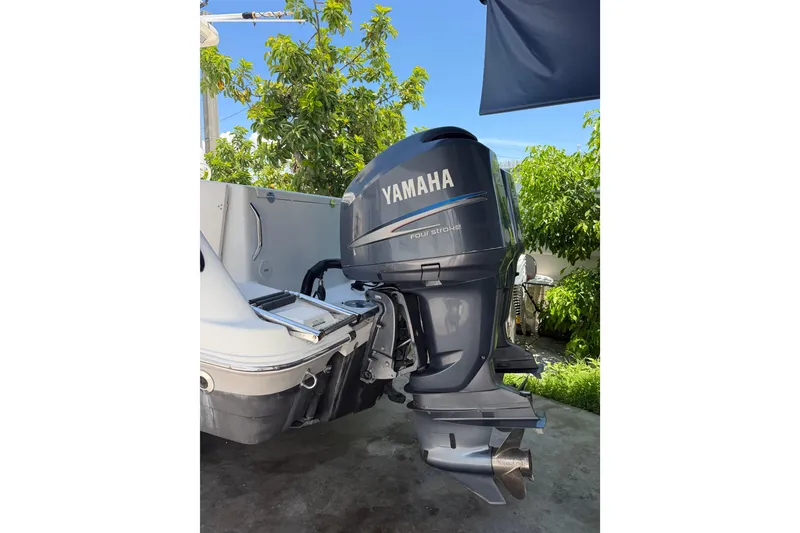 Slide: The Image of 2007 Robalo R260 Center Console with Yamaha outboard motor in a sunny outdoor setting. - 12