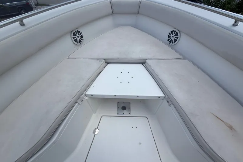 Slide: The Image of 2007 Robalo R260 Center Console boat interior with cushioned seating and speakers. - 34