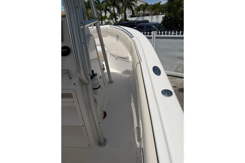 Slide: The Image of 2007 Robalo R260 Center Console boat deck with railing and seating area. - 10