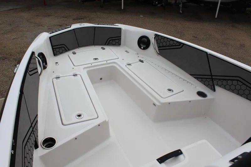 Slide: The Image of Interior view of a 2017 Scarab 195 boat, featuring spacious seating and storage compartments. - 15