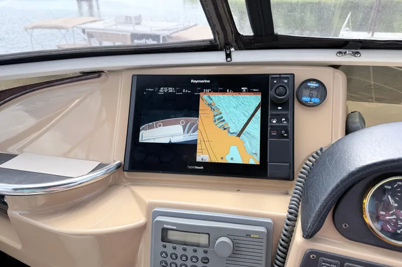 Slide: The Image of Dashboard of 2003 Carver 396 Motor Yacht with navigation system and controls. - 9