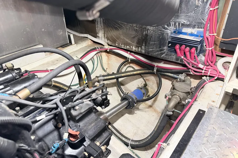 Slide: The Image of Engine room of a 2003 Carver 396 Motor Yacht, showcasing mechanical components and wiring. - 42