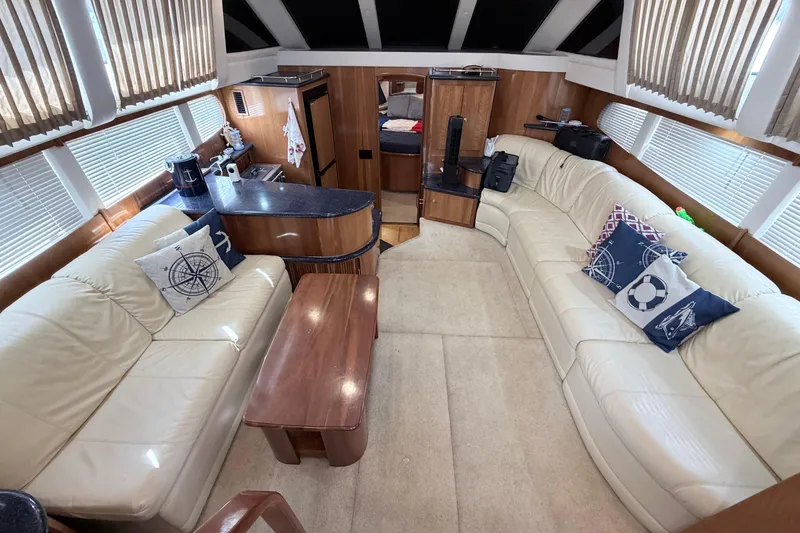 Slide: The Image of Luxurious interior of 2003 Carver 396 Motor Yacht with plush seating and nautical decor. - 15