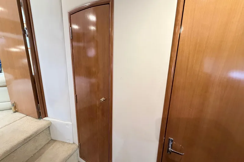Slide: The Image of Interior of 2003 Carver 396 Motor Yacht with wooden doors and carpeted stairs. - 36