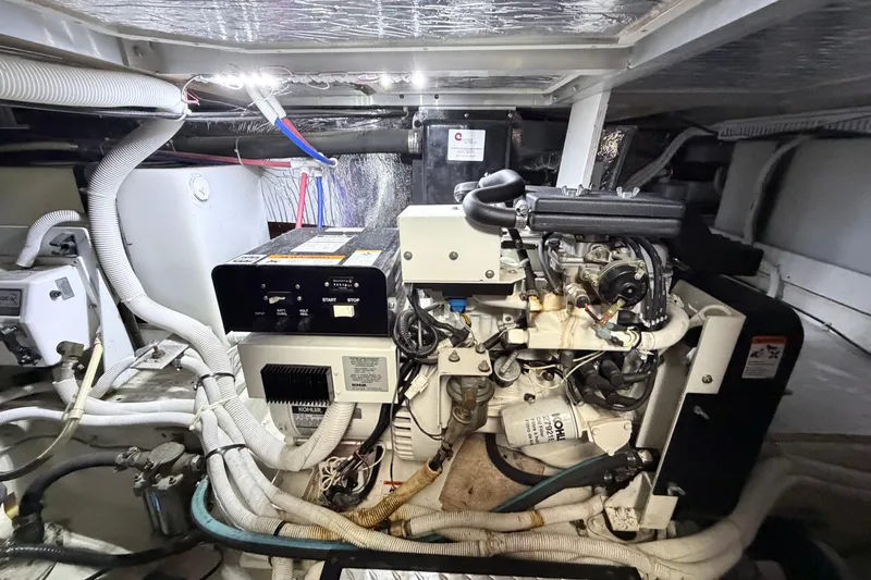 Slide: The Image of Engine room of 2003 Carver 396 Motor Yacht with Kohler generator and wiring. - 47