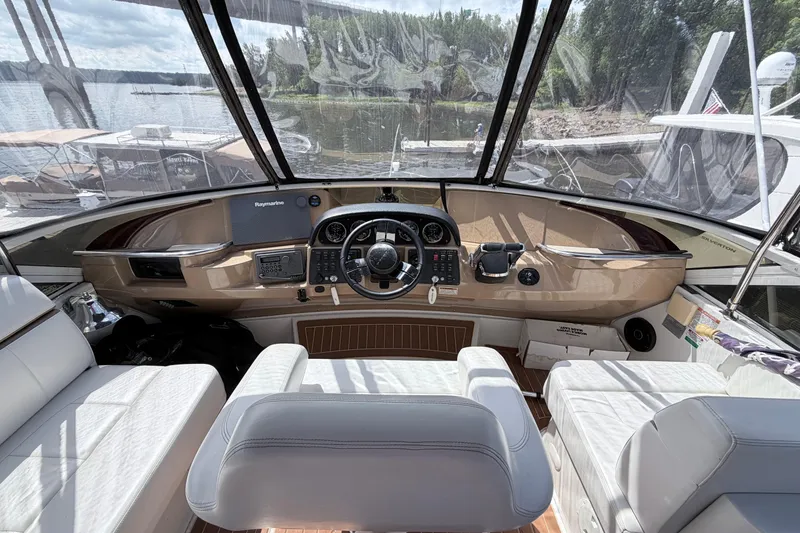 Slide: The Image of Interior helm of 2003 Carver 396 Motor Yacht with steering wheel and navigation equipment. - 7