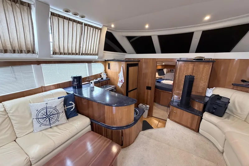 Slide: The Image of Luxurious interior of a 2003 Carver 396 Motor Yacht with elegant wood finishes. - 18