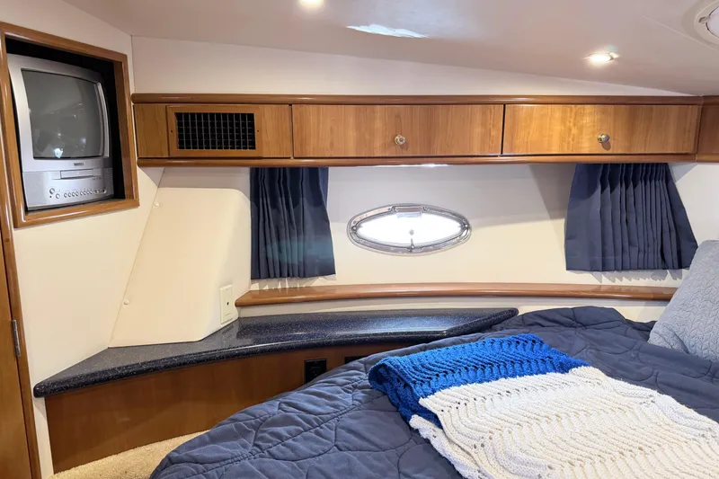 Slide: The Image of Interior of 2003 Carver 396 Motor Yacht with cozy bedroom and vintage TV. - 24