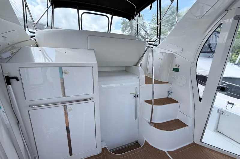 Slide: The Image of Interior of 2003 Carver 396 Motor Yacht with stairs and storage cabinets. - 5