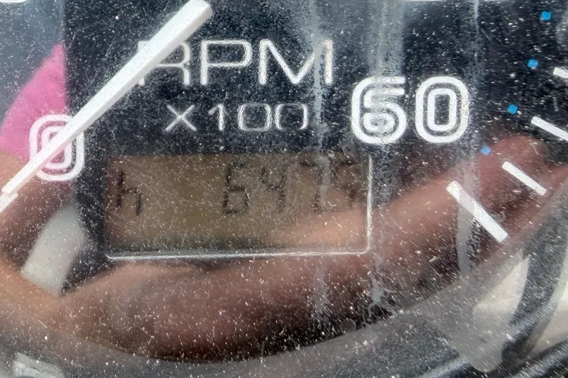 Slide: The Image of Close-up of RPM gauge on 2003 Carver 396 Motor Yacht, displaying 6473 hours. - 52