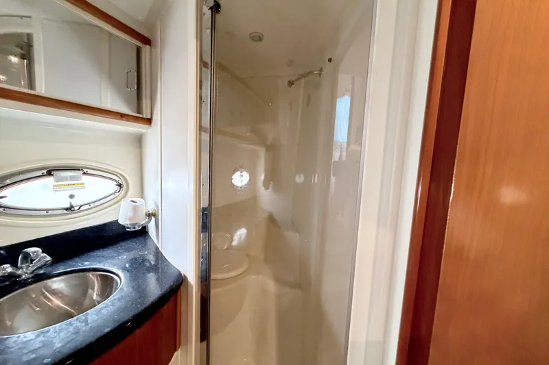 Slide: The Image of 2003 Carver 396 Motor Yacht bathroom with sink, mirror, and shower area. - 39