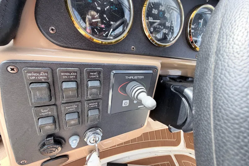 Slide: The Image of Control panel of a 2003 Carver 396 Motor Yacht with gauges and switches. - 10