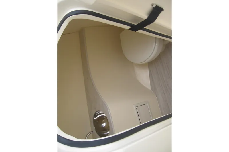 Slide: The Image of 2024 Scout 255 Dorado interior cabin with compact toilet and sleek design. - 8