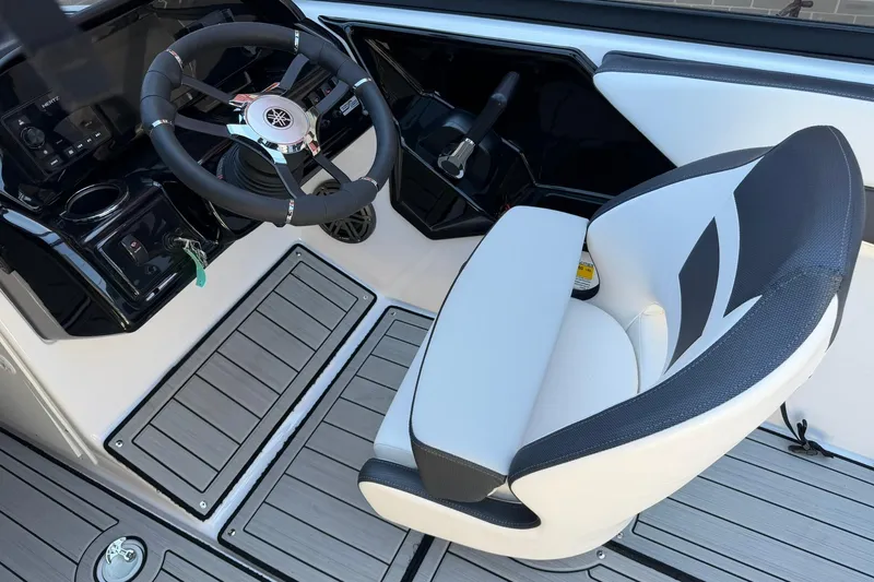 Slide: The Image of 2024 Yamaha Boats AR190 cockpit with steering wheel and captain's chair. - 5