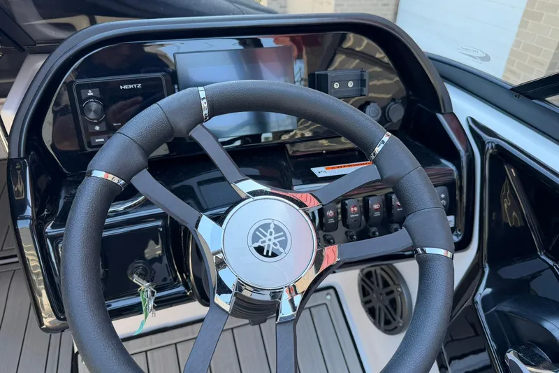 Slide: The Image of 2024 Yamaha Boats AR190 dashboard with steering wheel and control panel. - 3