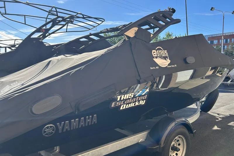 The Image of 2024 Yamaha Boats AR190 covered on trailer, featuring Bayside Jet Drive branding. - 0