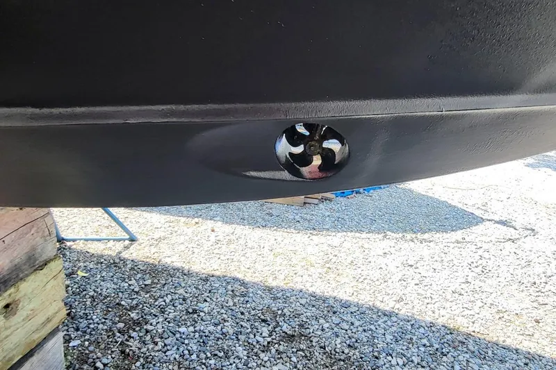 Slide: The Image of 2006 Back Cove 29 boat hull with visible propeller detail. - 5