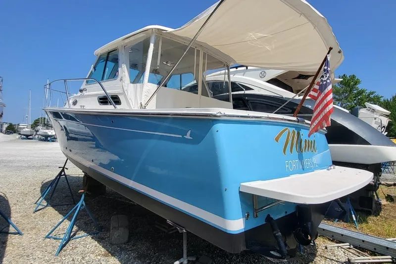 Slide: The Image of 2006 Back Cove 29 boat in dry dock, Fort Myers, FL, with American flag. - 7