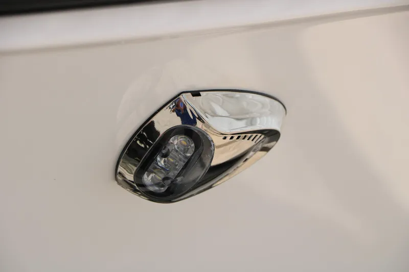 Slide: The Image of 2025 Chaparral 23 SSi boat detail, featuring a sleek chrome light fixture. - 15