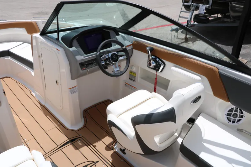 Slide: The Image of 2025 Chaparral 23 SSi boat interior with modern helm and seating. - 28