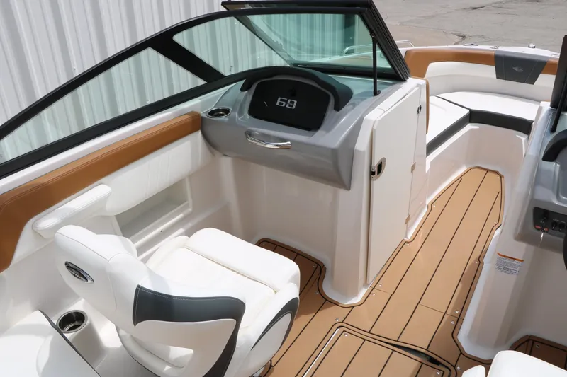 Slide: The Image of 2025 Chaparral 23 SSi boat interior with modern dashboard and comfortable seating. - 27