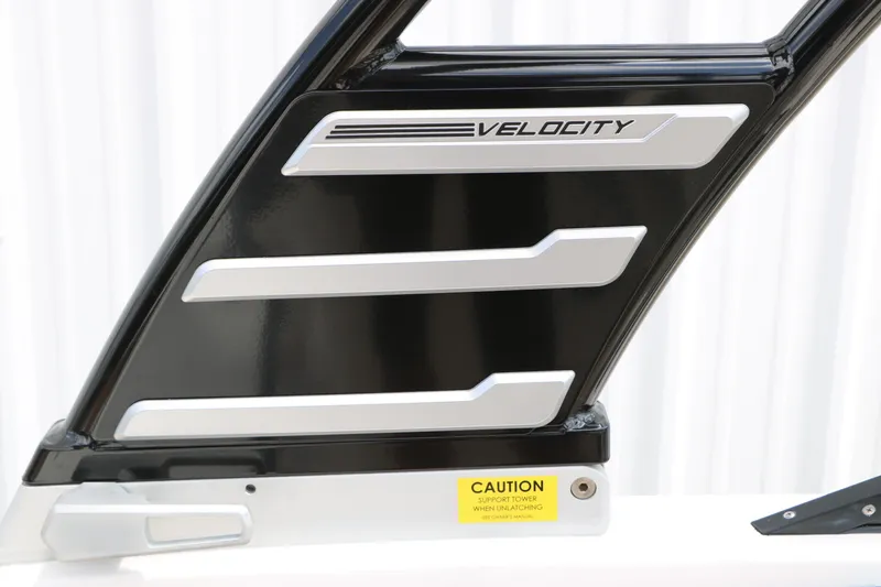 Slide: The Image of 2025 Chaparral 23 SSi boat tower detail with "Velocity" branding and caution label. - 33