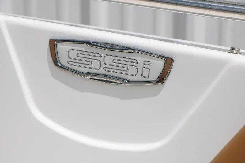 Slide: The Image of 2025 Chaparral 23 SSi boat emblem on white surface. - 42