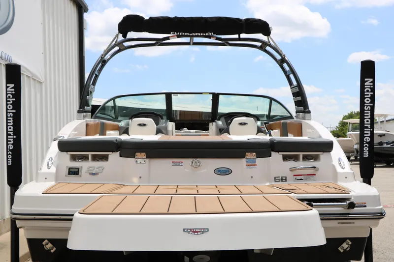 Slide: The Image of 2025 Chaparral 23 SSi boat rear view with swim platform and seating. - 11