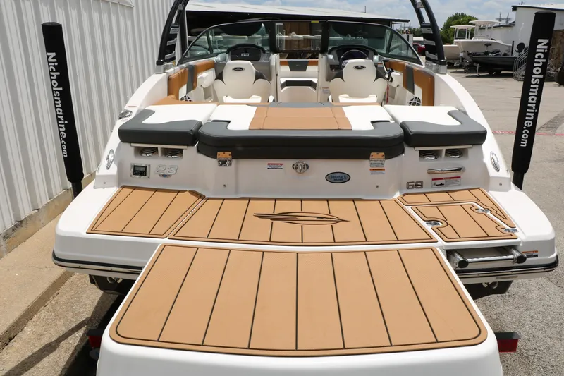 Slide: The Image of 2025 Chaparral 23 SSi boat with spacious deck and modern seating design. - 17