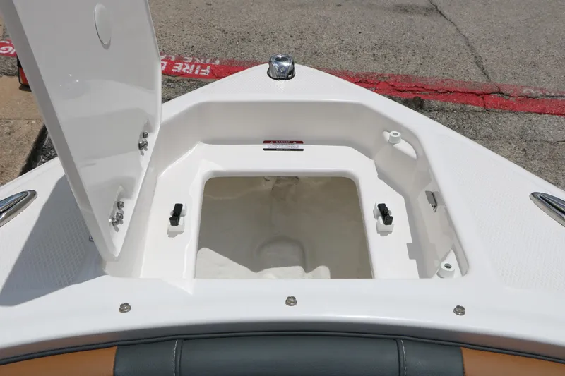 Slide: The Image of Open storage compartment on 2025 Chaparral 23 SSi boat, showcasing interior space. - 43
