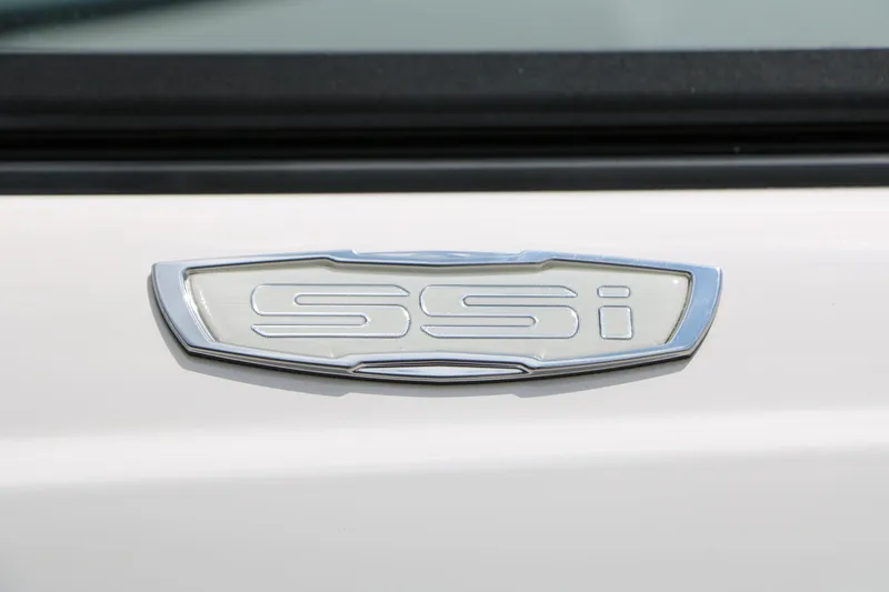 Slide: The Image of 2025 Chaparral 23 SSi emblem on a sleek white surface. - 14