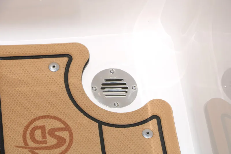 Slide: The Image of 2025 Chaparral 23 SSi boat deck with textured mat and metal drain. - 46