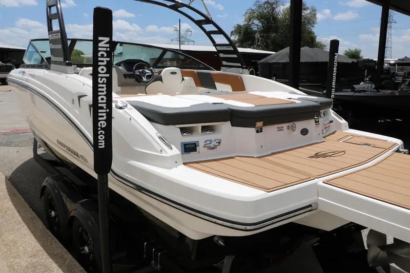 Slide: The Image of 2025 Chaparral 23 SSi boat with sleek design and spacious deck, displayed at Nichols Marine. - 21