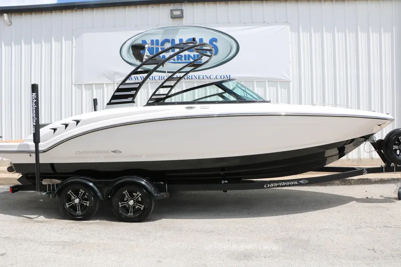 The Image of 2025 Chaparral 23 SSi boat on trailer at Nichols Marine dealership. - 1